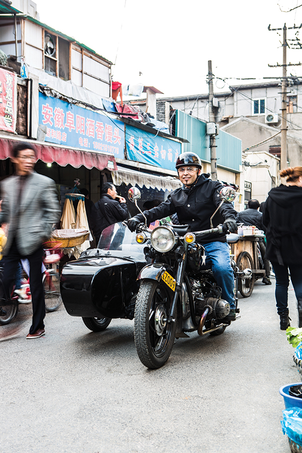 Shanghai Insiders tour rider Sammy Florez on one of the company's Chang-Jiang sidecars.
