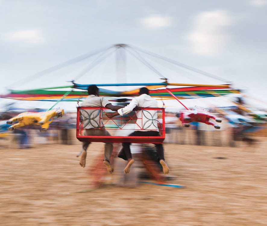 Having fun on the hand-driven carousel on Chennai's 13-kilometer-long Marina Beach, said to be the longest-and more crowed-stretch of sand in the country.