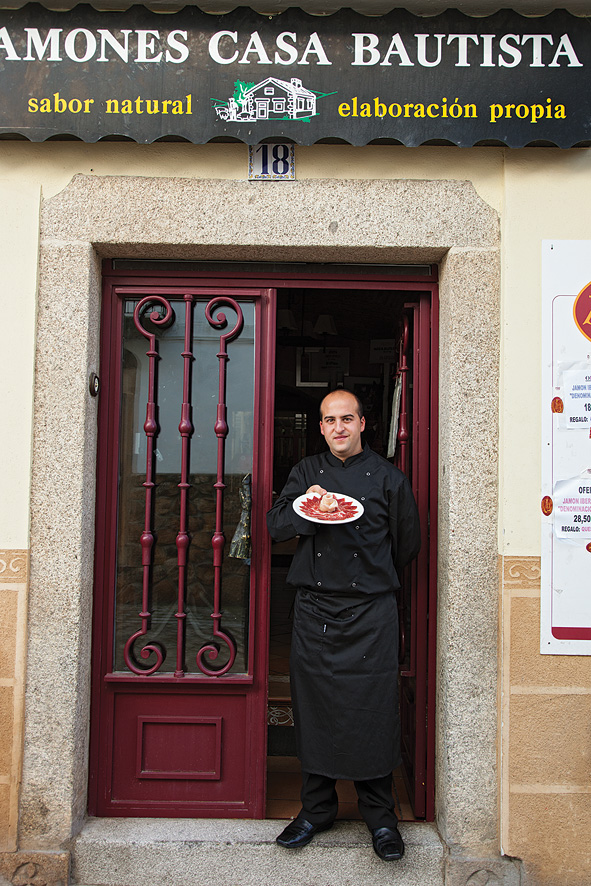 Master jamón carver Juan Jose Sanchez Trejo with paper-thin slices of Iberian ham outside Casa Bautista in Montánchez.
