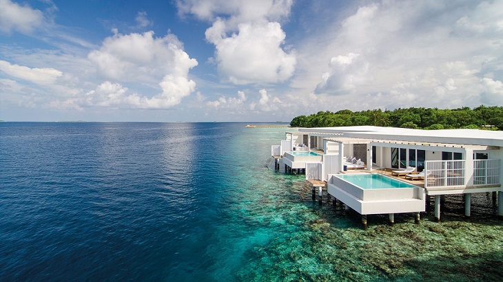 Reef-side overwater villas at Amilla Maldives.