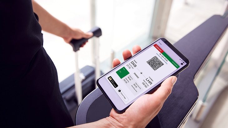 An Emirates mobile boarding pass displayed on a smartphone.