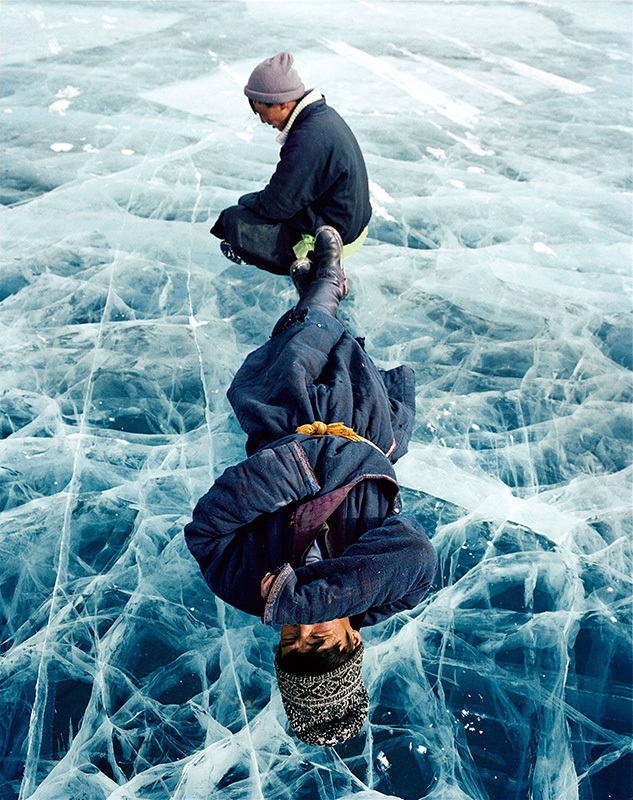 Men at rest on the winter ice of northwest Mongolia's Lake Khövsgöl, by Frédéric Lagrange.
