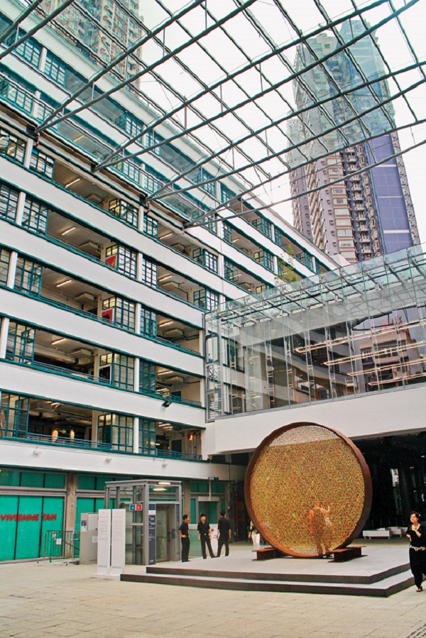 A gorgeous glass-roofed courtyard connects the buildings.