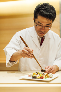 Sushi master Hiroki Sudou at work.