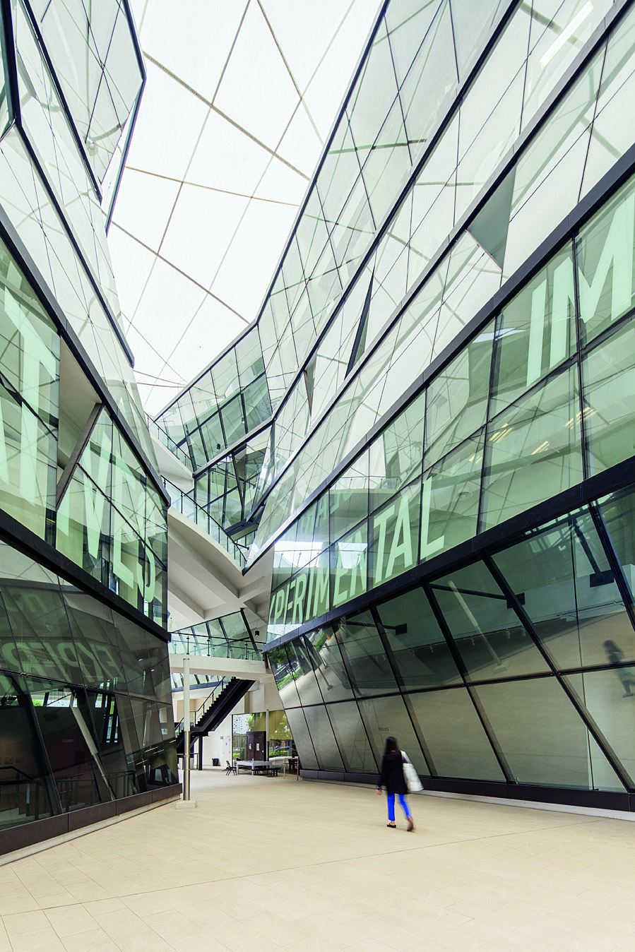 The soaring central atrium at LaSalle College of the Arts, which comprises six faceted, organically shaped buildings.