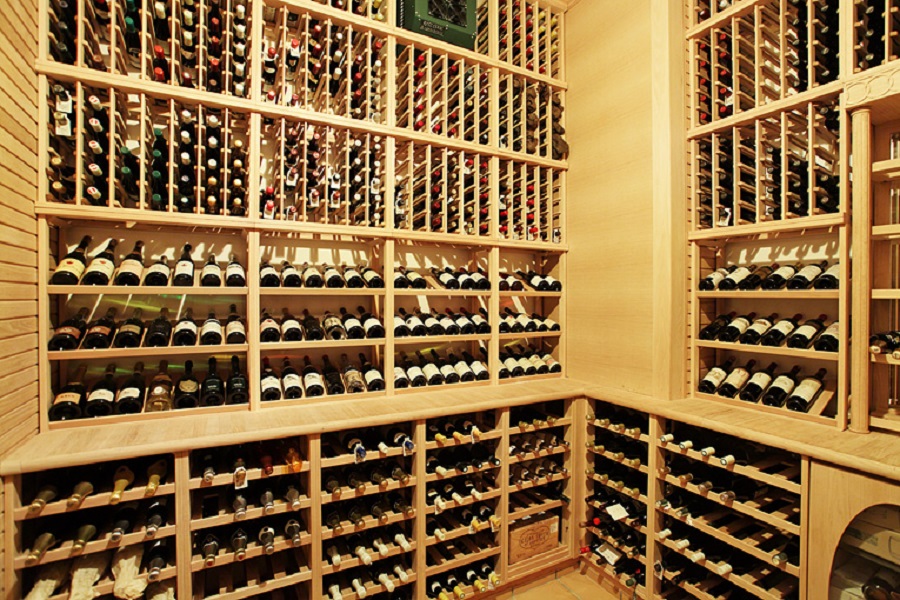 Behind a solid mahogany door, the wine cellar has a museum-like collection of vintage wines.
